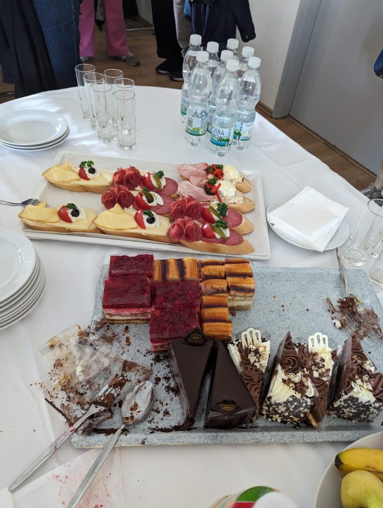 Cakes and sandwiches on a table