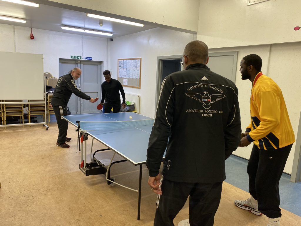 Archbishop Costakis playing table tennis