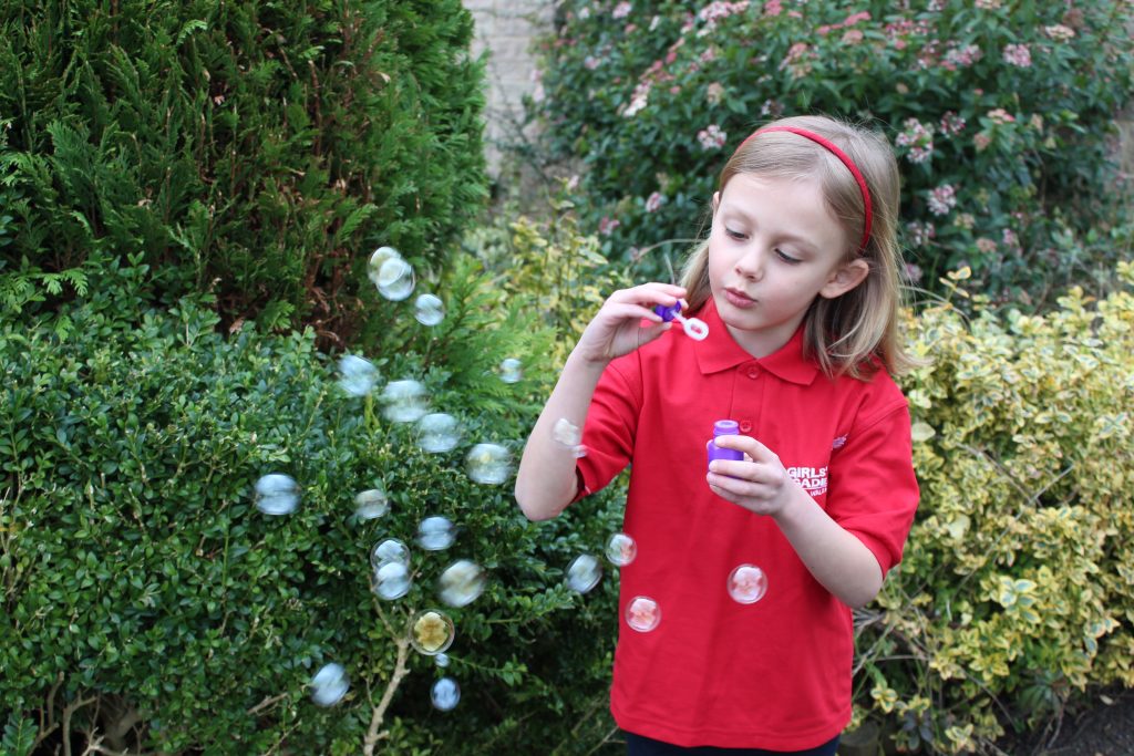 Girls Brigade member blowing bubbles